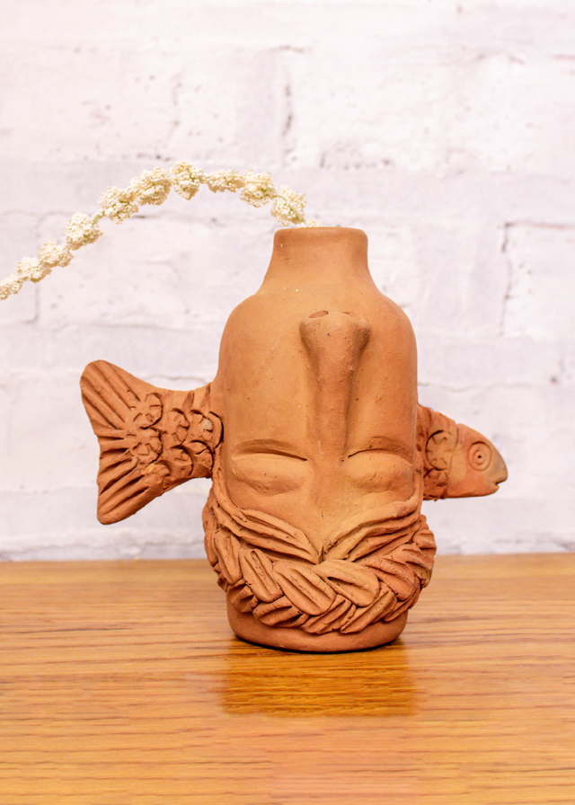 Face bottle with fish